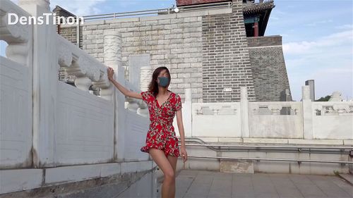 Chinese girl walk nude monument
