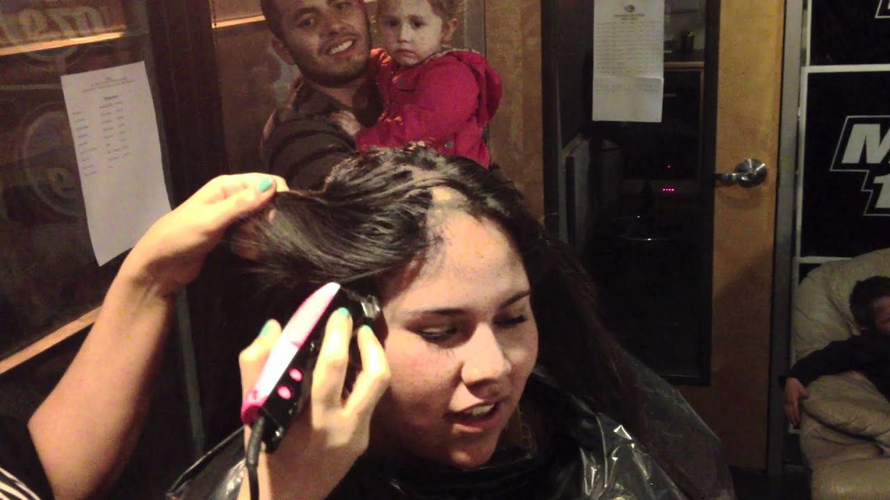 Women getting head shaved